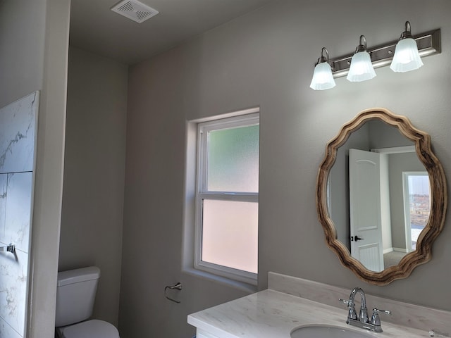13129 E 47th Ln, Yuma, AZ 85367 - half bath with vanity, toilet, and visible vents