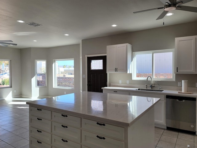 13129 E 47th Ln, Yuma, AZ 85367 - kitchen with light tile patterned flooring, ceiling fan, a sink, stainless steel dishwasher, and visible vents