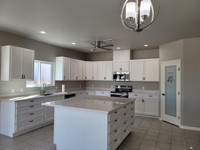 13129 E 47th Ln, Yuma, AZ 85367 - kitchen with appliances with stainless steel finishes, a sink, light countertops, light tile patterned floors, and visible vents