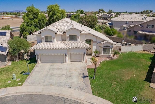 4031 W 16th Pl, Yuma, AZ 85364 - view of front of home with a tiled roof, stucco siding, driveway, a garage, and a residential view