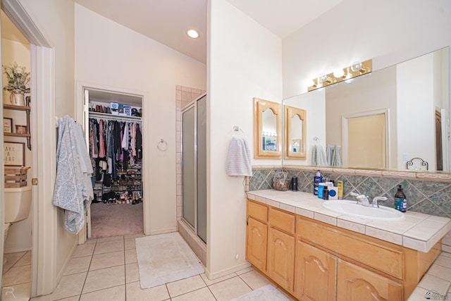 4031 W 16th Pl, Yuma, AZ 85364 - full bathroom featuring tile patterned flooring, a stall shower, vanity, and toilet