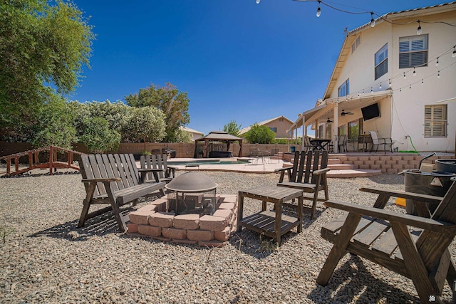 4031 W 16th Pl, Yuma, AZ 85364 - view of patio with an outdoor fire pit, a gazebo, and a ceiling fan