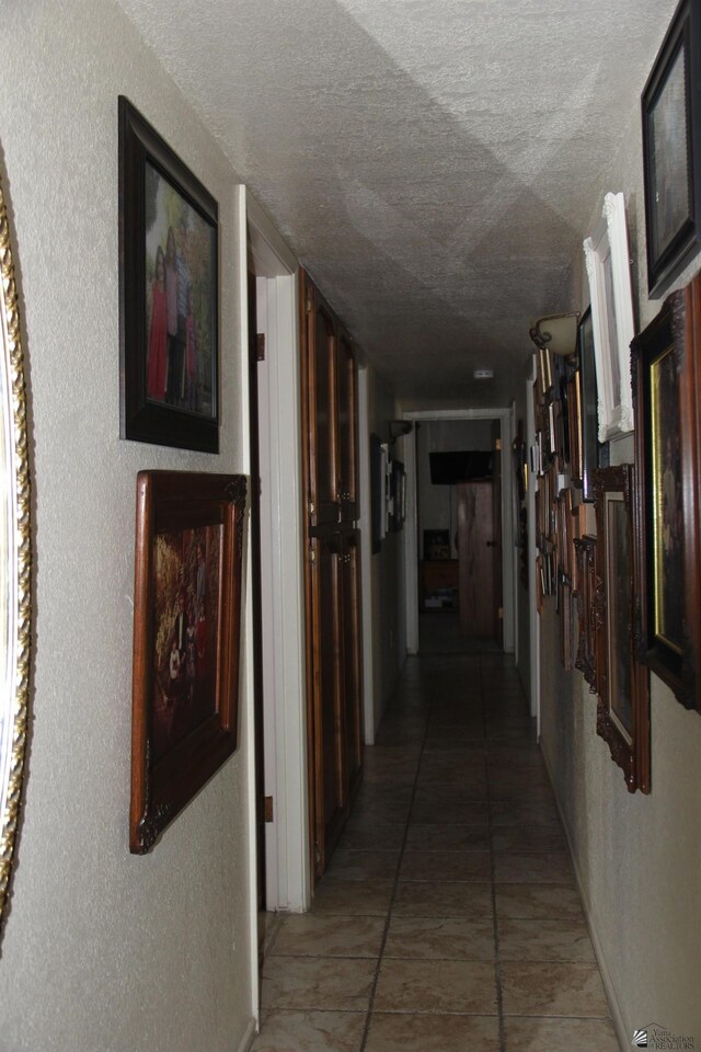 1936 W 15th Pl, Yuma, AZ 85364 - hall featuring a textured ceiling, light tile patterned flooring, and a textured wall