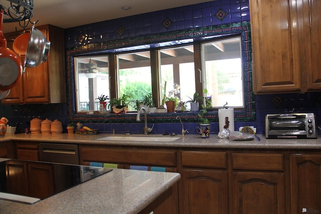 1936 W 15th Pl, Yuma, AZ 85364 - kitchen featuring a sink, backsplash, black electric stovetop, and stainless steel dishwasher