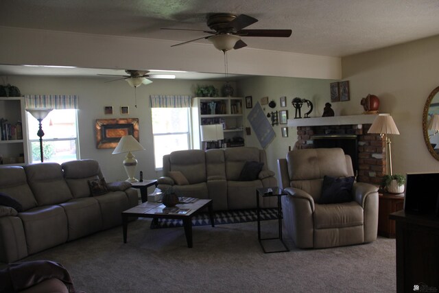 1936 W 15th Pl, Yuma, AZ 85364 - living room featuring a ceiling fan, carpet floors, a brick fireplace, and a textured ceiling
