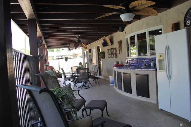 1936 W 15th Pl, Yuma, AZ 85364 - view of patio featuring ceiling fan, outdoor dining space, and a sink