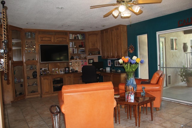 1936 W 15th Pl, Yuma, AZ 85364 - living room with ceiling fan, light tile patterned flooring, and a textured ceiling