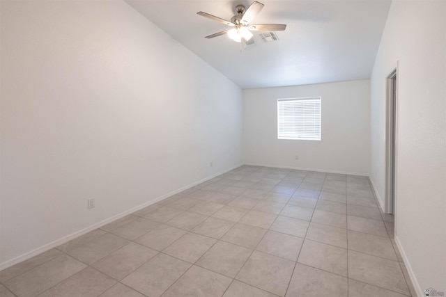 376 N 22nd Dr, San Luis, AZ 85336 - unfurnished room with baseboards, ceiling fan, light tile patterned floors, and lofted ceiling