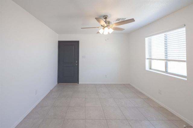 376 N 22nd Dr, San Luis, AZ 85336 - spare room with a ceiling fan, baseboards, visible vents, and light tile patterned floors