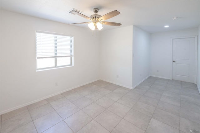 376 N 22nd Dr, San Luis, AZ 85336 - empty room with light tile patterned floors, baseboards, ceiling fan, and visible vents