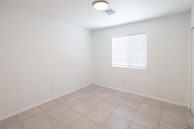 376 N 22nd Dr, San Luis, AZ 85336 - empty room with visible vents, baseboards, and light tile patterned floors