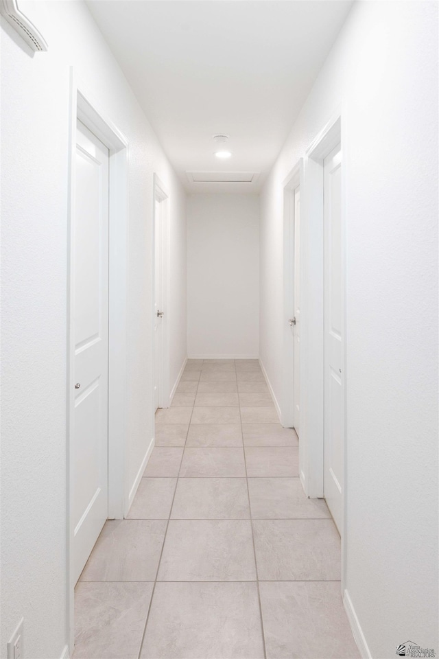 376 N 22nd Dr, San Luis, AZ 85336 - hall with baseboards and light tile patterned flooring