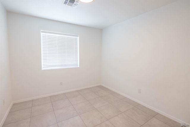 376 N 22nd Dr, San Luis, AZ 85336 - empty room featuring light tile patterned flooring, baseboards, and visible vents