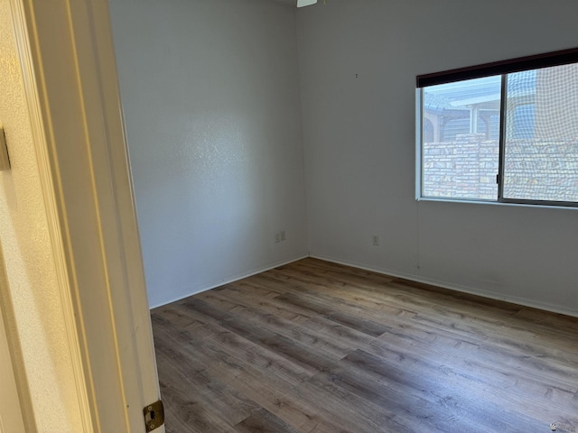 13815 E 54th St, Yuma, AZ 85367 - spare room featuring wood finished floors