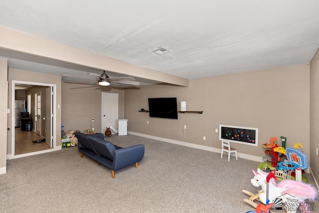 living area featuring baseboards, ceiling fan, carpet flooring, and visible vents