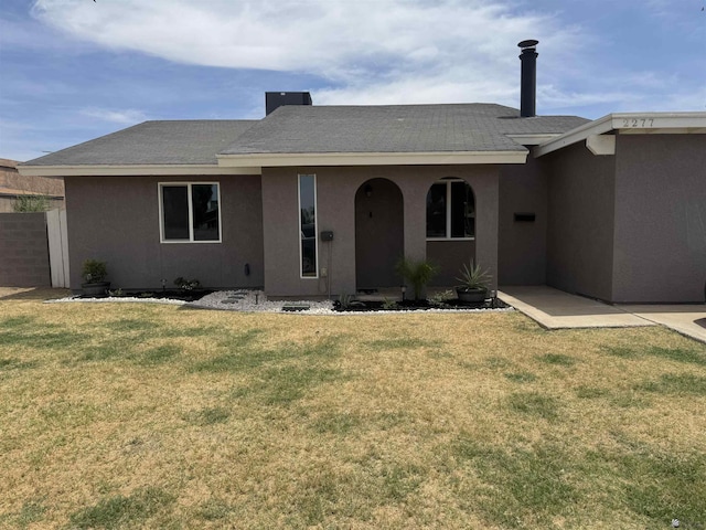 2277 S Camino Tierra, Yuma, AZ 85364 - ranch-style house featuring stucco siding, a front lawn, and a shingled roof