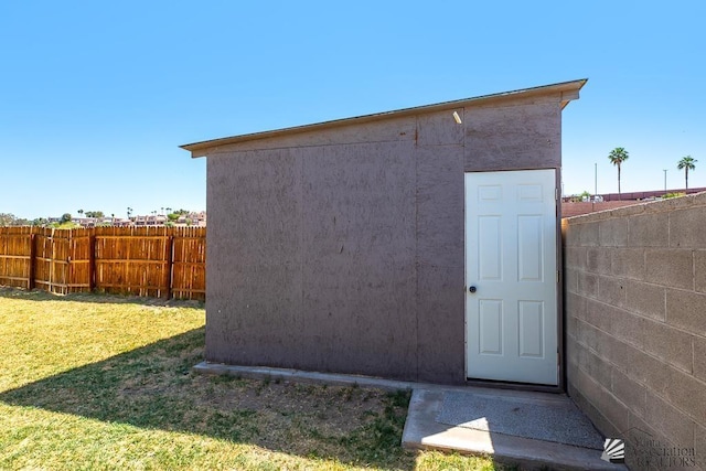 view of shed with a fenced backyard