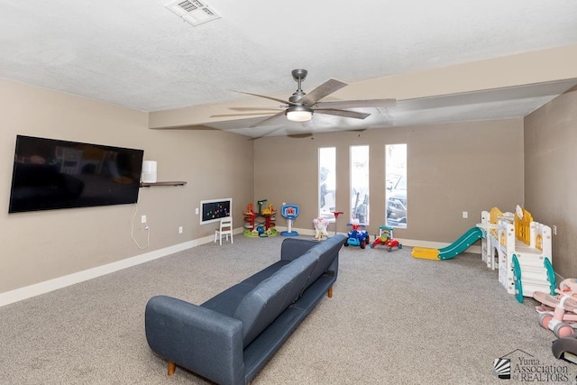 playroom with ceiling fan, visible vents, baseboards, and carpet
