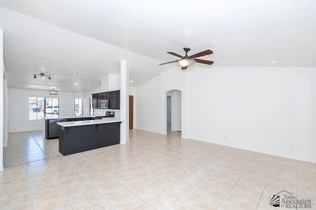 2967 S 47th Ave, Yuma, AZ 85364 - kitchen featuring open floor plan, lofted ceiling, light countertops, and appliances with stainless steel finishes
