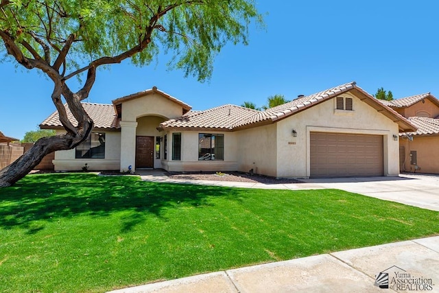 2967 S 47th Ave, Yuma, AZ 85364 - mediterranean / spanish-style home with an attached garage, stucco siding, concrete driveway, and a tiled roof