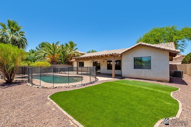 2967 S 47th Ave, Yuma, AZ 85364 - rear view of house with stucco siding, a fenced backyard, a tile roof, and a patio area