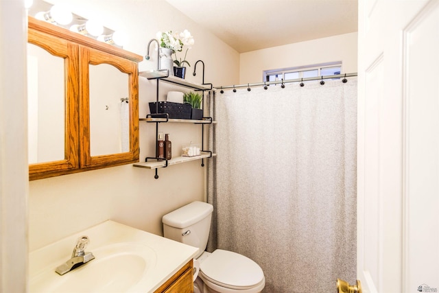 full bathroom with vanity, a shower with shower curtain, and toilet
