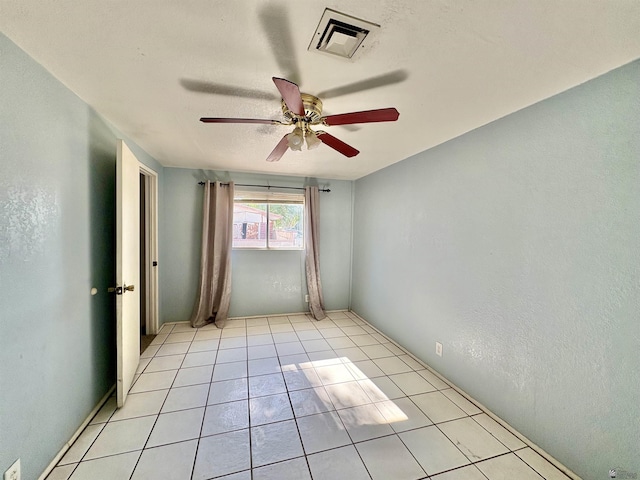 1805 S Dora Ave, Yuma, AZ 85364 - spare room with ceiling fan and light tile patterned flooring