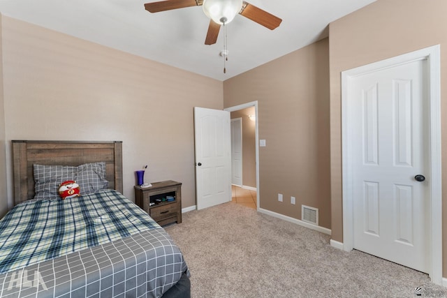 bedroom with carpet flooring, a ceiling fan, baseboards, and visible vents