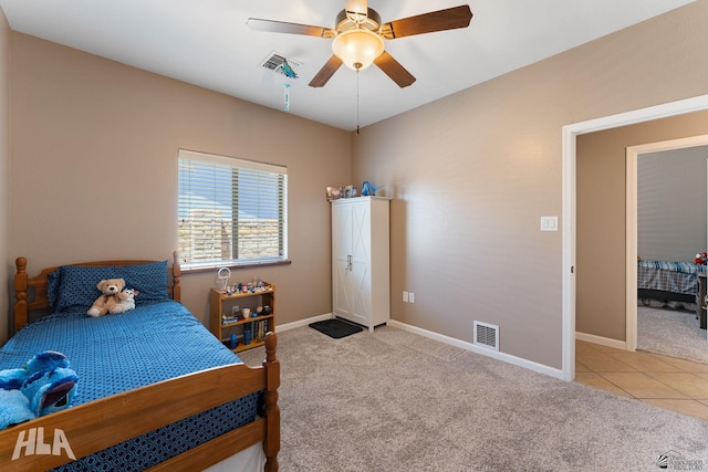 tiled bedroom featuring baseboards, carpet, a ceiling fan, and visible vents