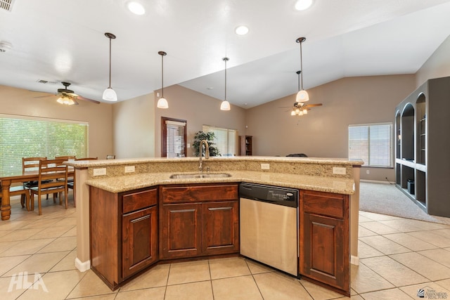 kitchen with a sink, ceiling fan, vaulted ceiling, and dishwasher
