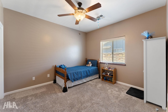 carpeted bedroom with baseboards, ceiling fan, and visible vents