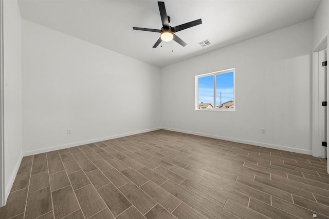 10778 E 45th Ln, Yuma, AZ 85367 - spare room with dark wood-style flooring, ceiling fan, and baseboards