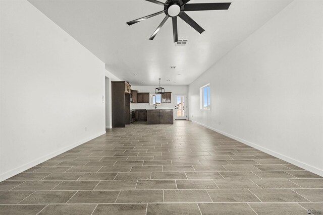 10778 E 45th Ln, Yuma, AZ 85367 - kitchen with appliances with stainless steel finishes, wood finish floors, dark brown cabinets, light countertops, and a sink