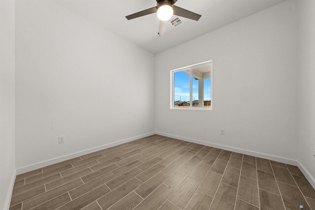 10778 E 45th Ln, Yuma, AZ 85367 - spare room featuring wood finish floors, ceiling fan, lofted ceiling, and baseboards