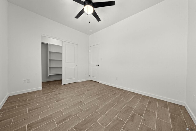 10778 E 45th Ln, Yuma, AZ 85367 - unfurnished bedroom featuring wood finished floors, baseboards, a closet, and a ceiling fan