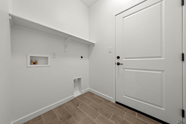 10778 E 45th Ln, Yuma, AZ 85367 - laundry room featuring washer hookup, wood tiled floors, hookup for an electric dryer, and baseboards
