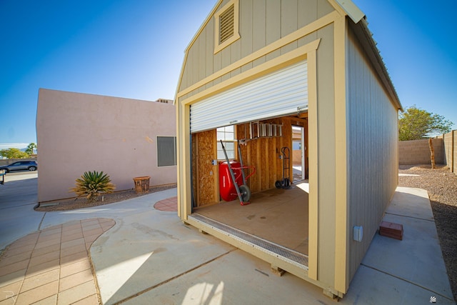 view of patio with an outbuilding