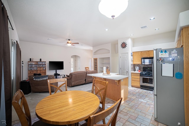 dining room featuring ceiling fan