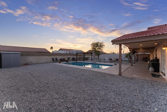 view of pool with a fenced in pool, a patio area, and a fenced backyard