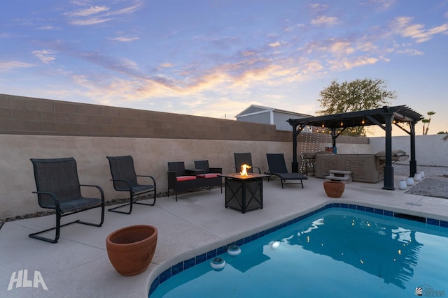 view of swimming pool with a fenced in pool, outdoor dry bar, an outdoor fire pit, a patio area, and a fenced backyard