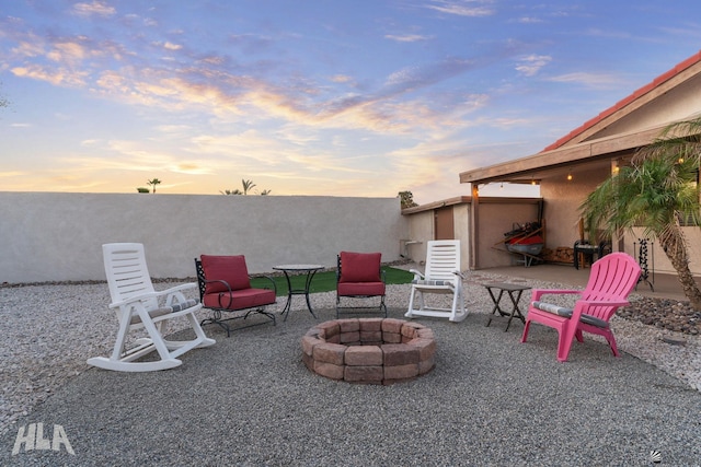 view of patio / terrace featuring an outdoor fire pit