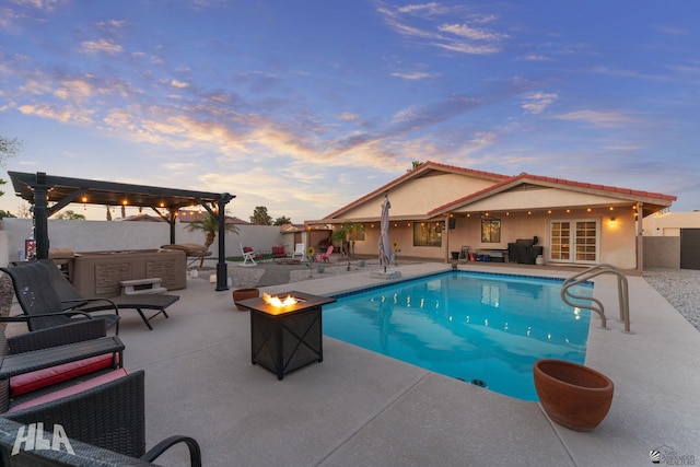 pool at dusk featuring a patio area, a fenced backyard, a fenced in pool, and a hot tub