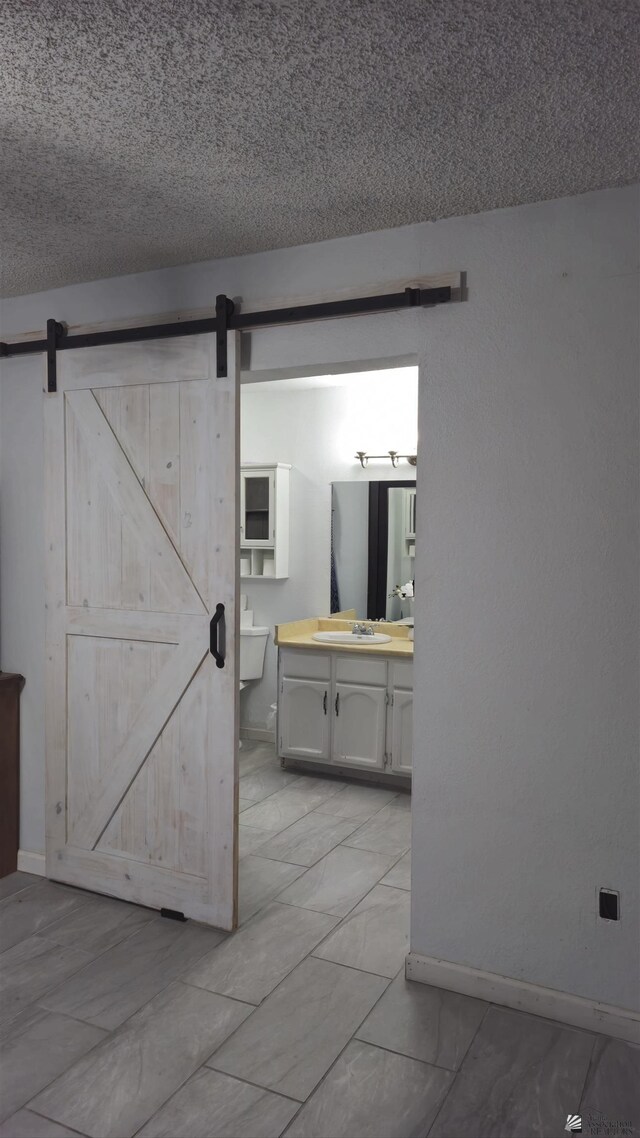 1957 Athens Ave, Yuma, AZ 85364 - interior space featuring vanity, baseboards, and a textured ceiling