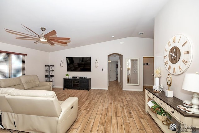 10120 S Galaxy Ave, Yuma, AZ 85367 - living room featuring a ceiling fan, arched walkways, vaulted ceiling, and light wood finished floors