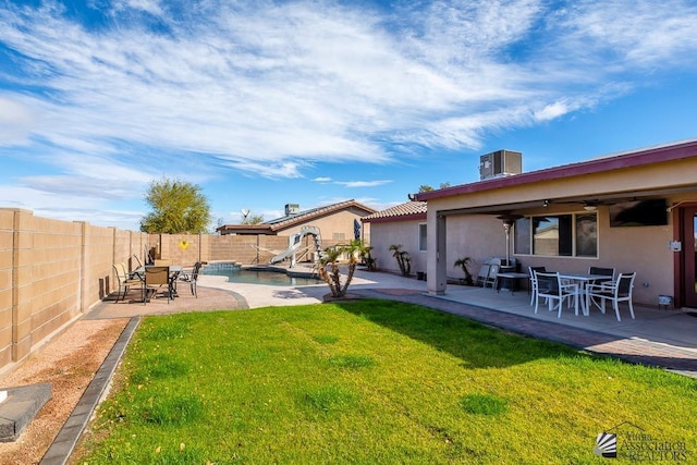 10120 S Galaxy Ave, Yuma, AZ 85367 - view of yard with ceiling fan, a fenced backyard, a fenced in pool, a patio area, and outdoor dining space