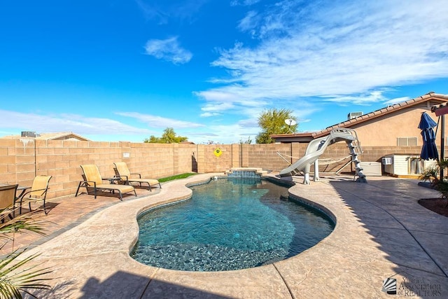 10120 S Galaxy Ave, Yuma, AZ 85367 - view of pool featuring a water slide, a fenced backyard, a patio area, and a fenced in pool