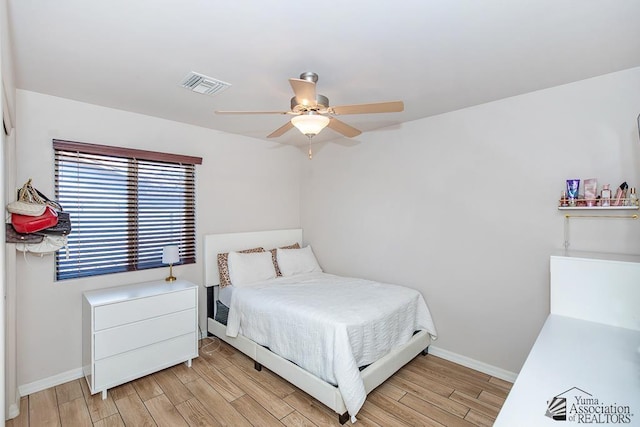 10120 S Galaxy Ave, Yuma, AZ 85367 - bedroom with visible vents, a ceiling fan, light wood finished floors, and baseboards