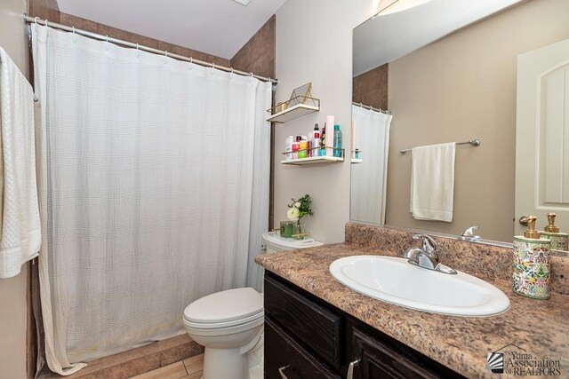 10120 S Galaxy Ave, Yuma, AZ 85367 - bathroom with vanity, a shower with shower curtain, and toilet