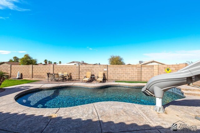 10120 S Galaxy Ave, Yuma, AZ 85367 - view of pool with a patio, a fenced backyard, a water slide, and a fenced in pool