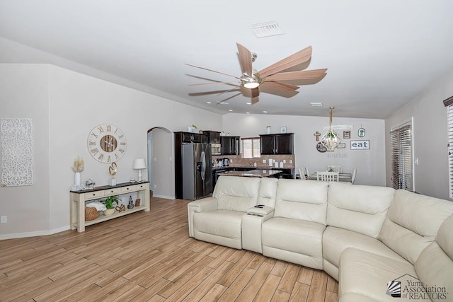 10120 S Galaxy Ave, Yuma, AZ 85367 - living area featuring a ceiling fan, baseboards, visible vents, and light wood-type flooring